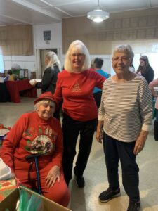 Three members, including two founding member, of Leona Valley Sertoma, pose for a photo at the Leona Valley Sertoma Holiday Dinner.