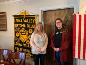 Charlene Moore and Emily Moulton in front of the Leona Valley Sertoma banner. Emily was the guest speaker about Antelope Valley College.